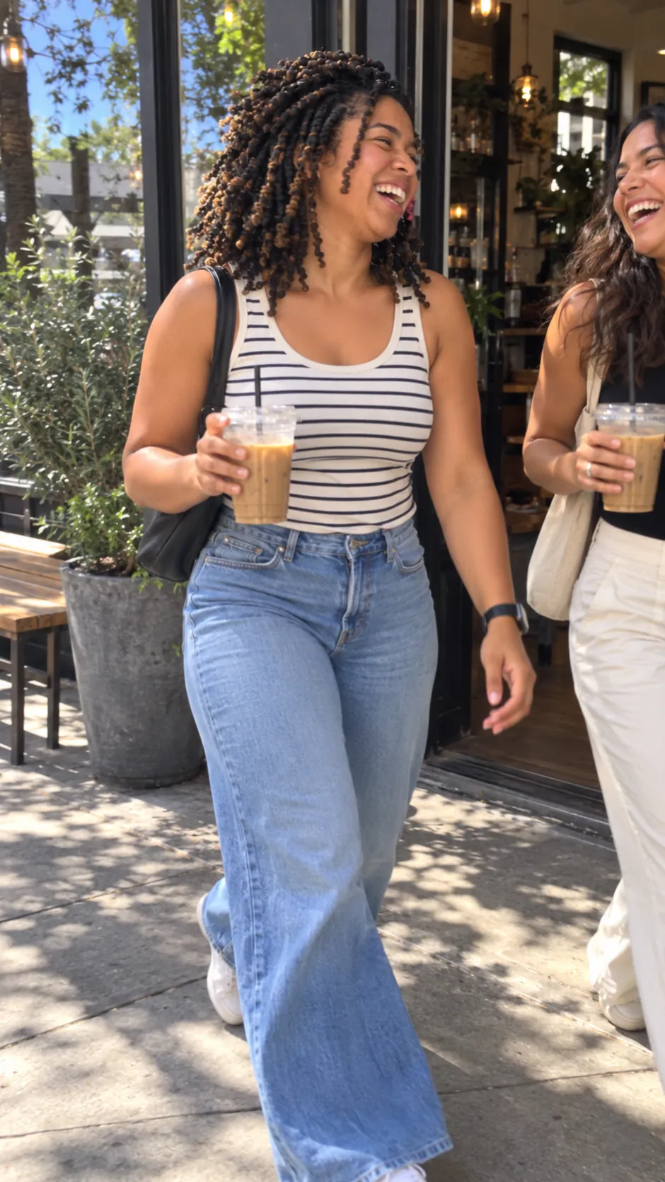 AI-generated example of a future self: a woman laughing as she walks out of a café with an iced coffee.